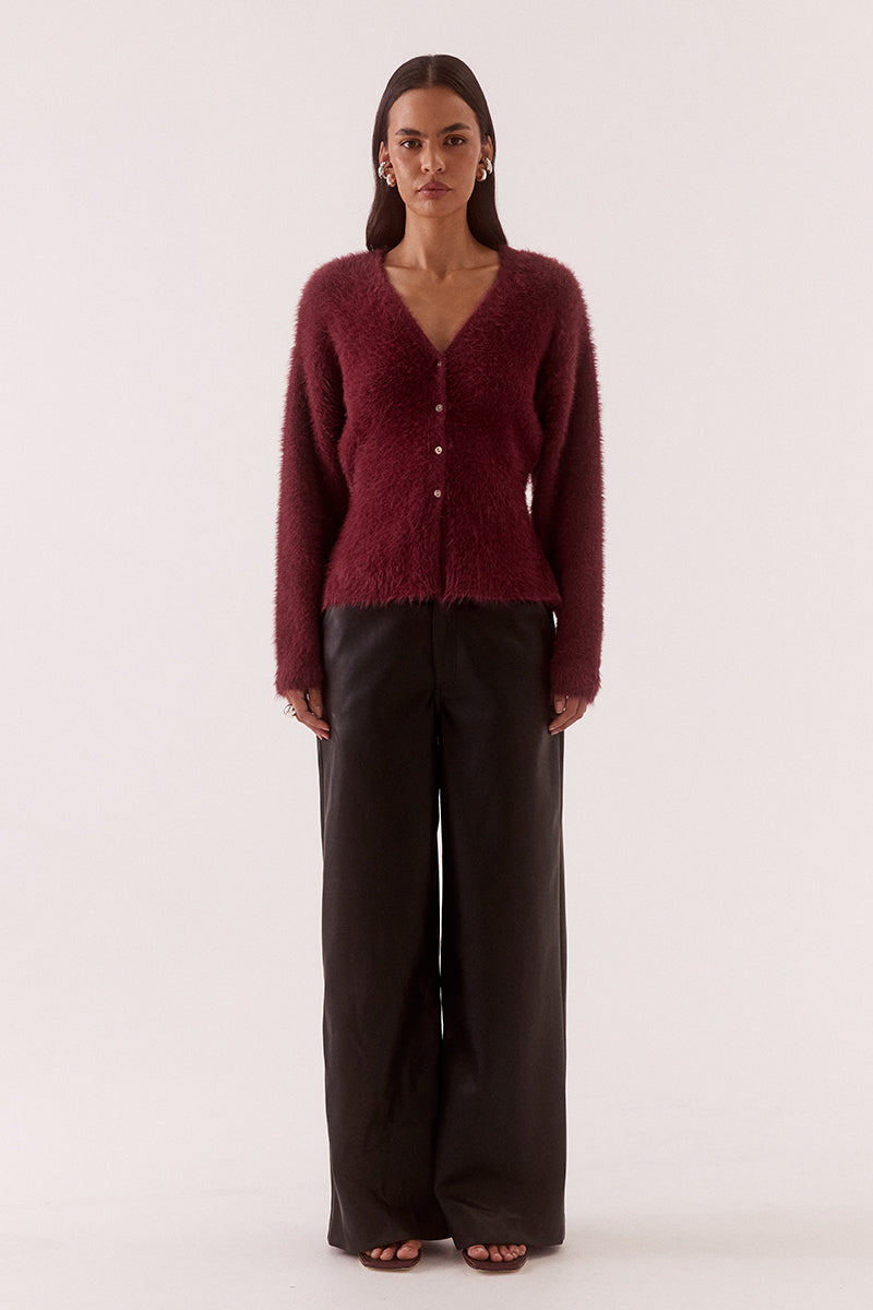 Women’s fluffy nylon knit cardigan with relaxed fit, low V-neck, dropped shoulders, fitted waist, button closure and side splits
