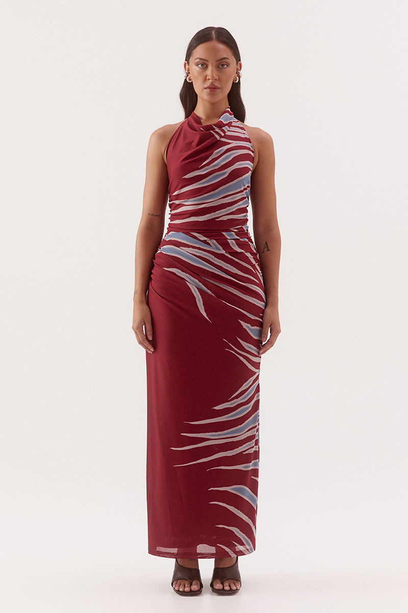 Women's fitted stretch mesh midi dress in exclusive print with a halter cowl neckline, gathered bodice, layered skirt, and side split detail.