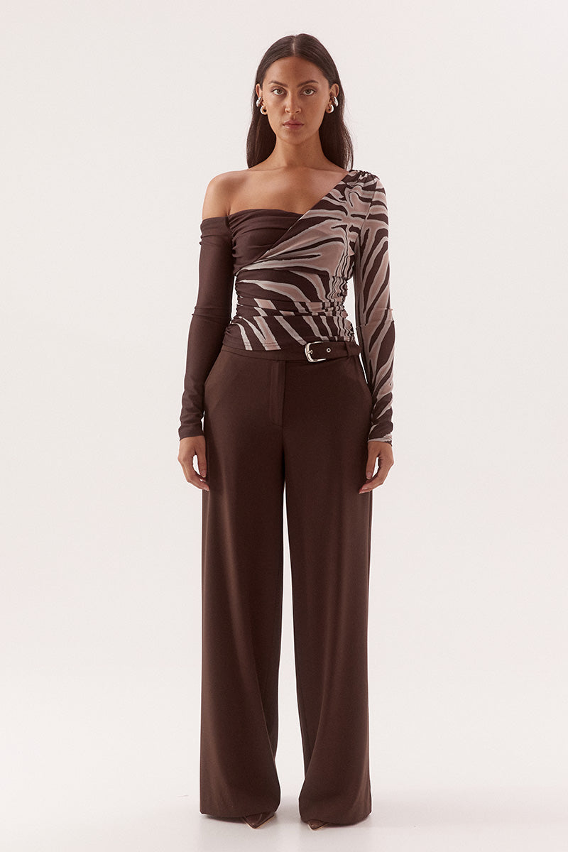 Women's fitted stretch mesh long sleeve top in exclusive print with asymmetric off-shoulder neckline, ruching detail, and body-lined finish.