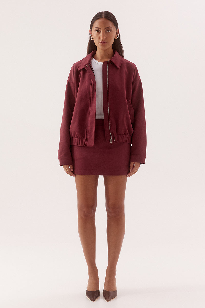 Women’s faux suede mid rise mini skort with A line skirt, fitted internal shorts, belt loops and side zip closure