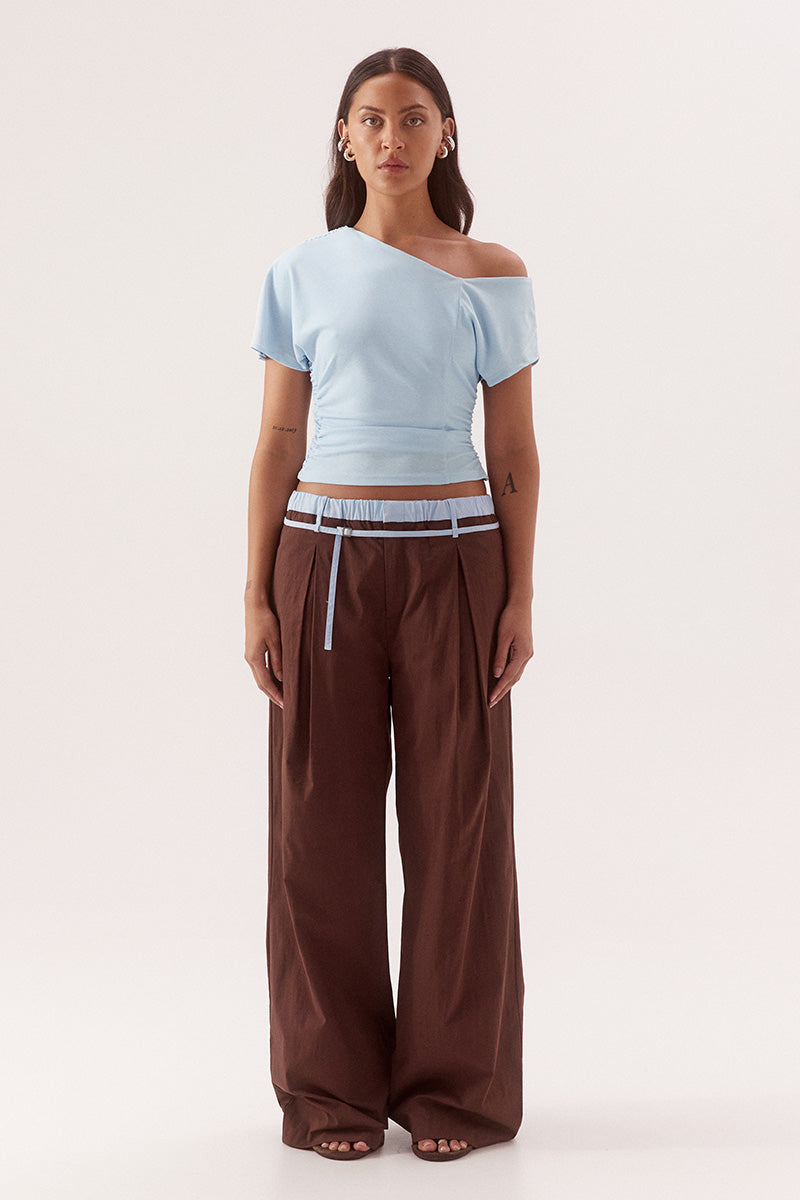 Textured mesh off shoulder top with asymmetric neckline, gathered waist, short sleeves and versatile shoulder styling