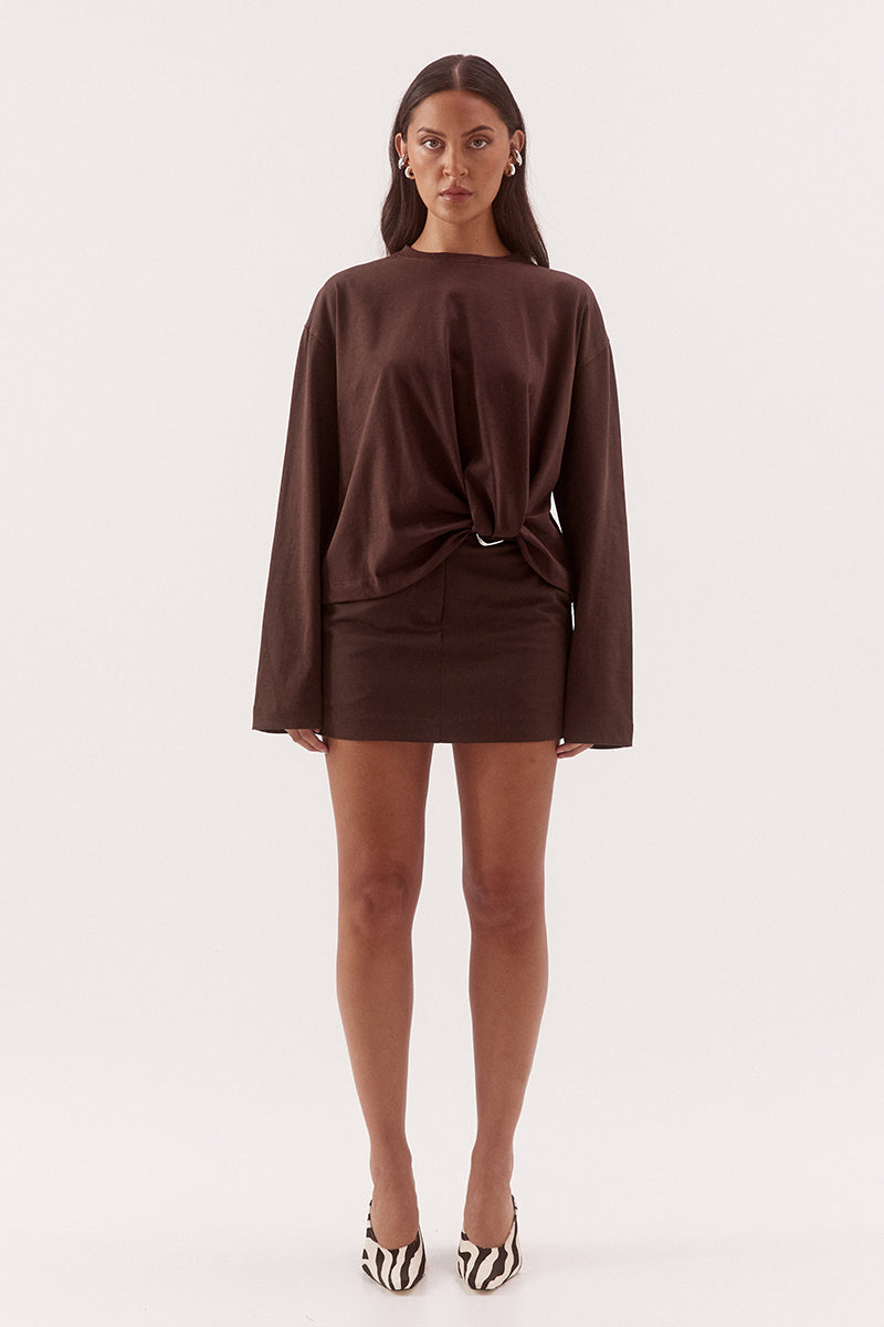 Women's oversized cotton long sleeve tee with dropped shoulders, crew neckline, and tucked front detail creating a flattering shaped hem.