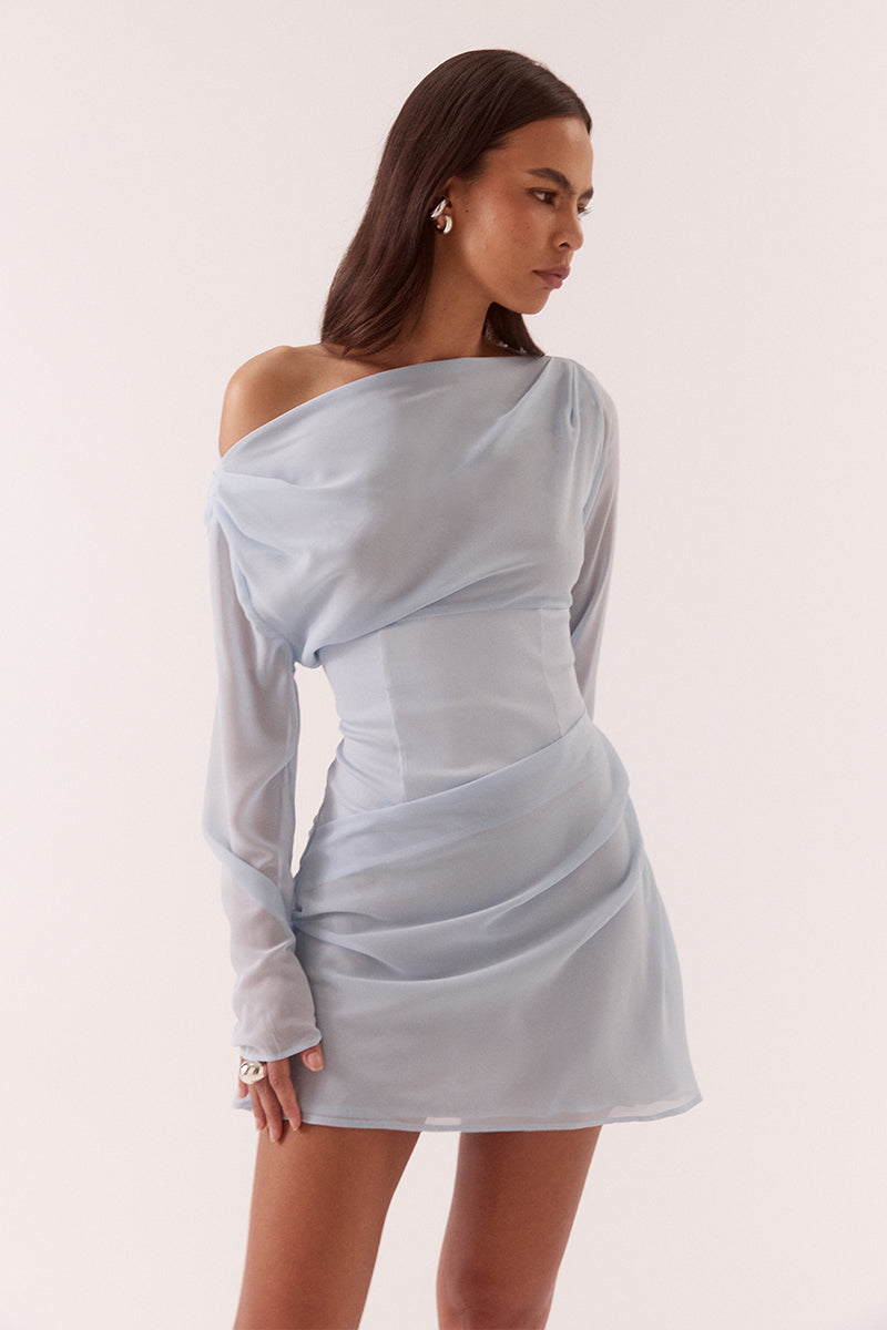 Women’s A-line mini dress with chiffon bodice, textured stretch waistband, draped overlayer skirt, boat neck neckline, long sleeves, and side zip closure.