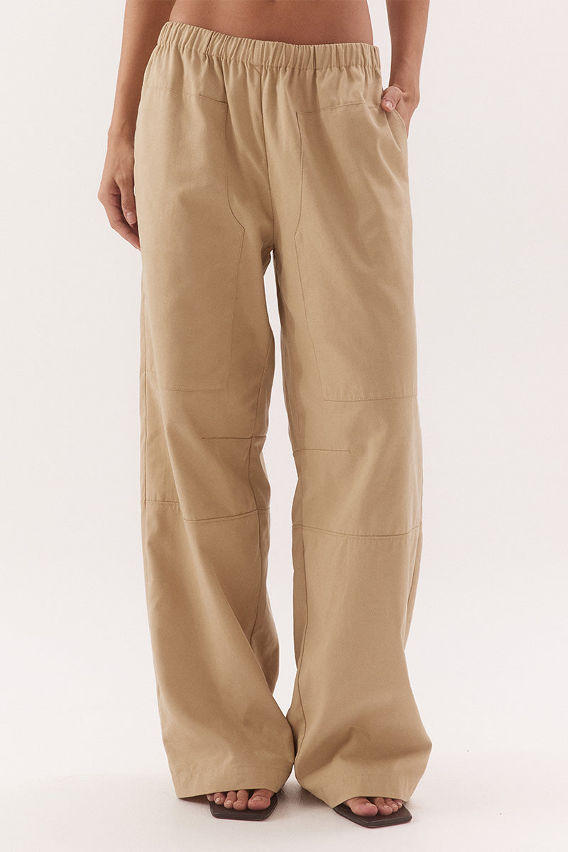 Women's cotton Lyocell blend mid-rise relaxed straight leg pants with oversized side patch pockets, elastic waist and dart detailing.