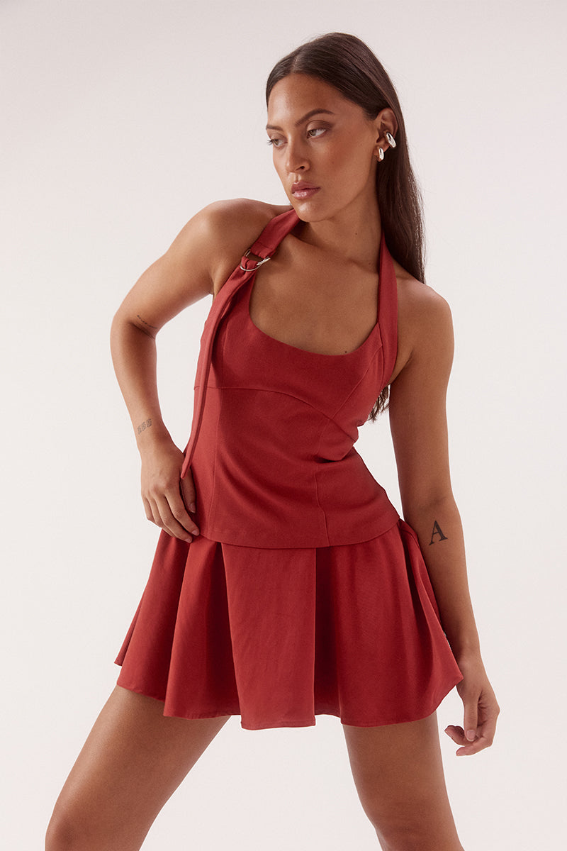 Black halter neck mini dress with adjustable strap, silver D ring detail, shaped bodice and soft gathered Lyocell skirt
