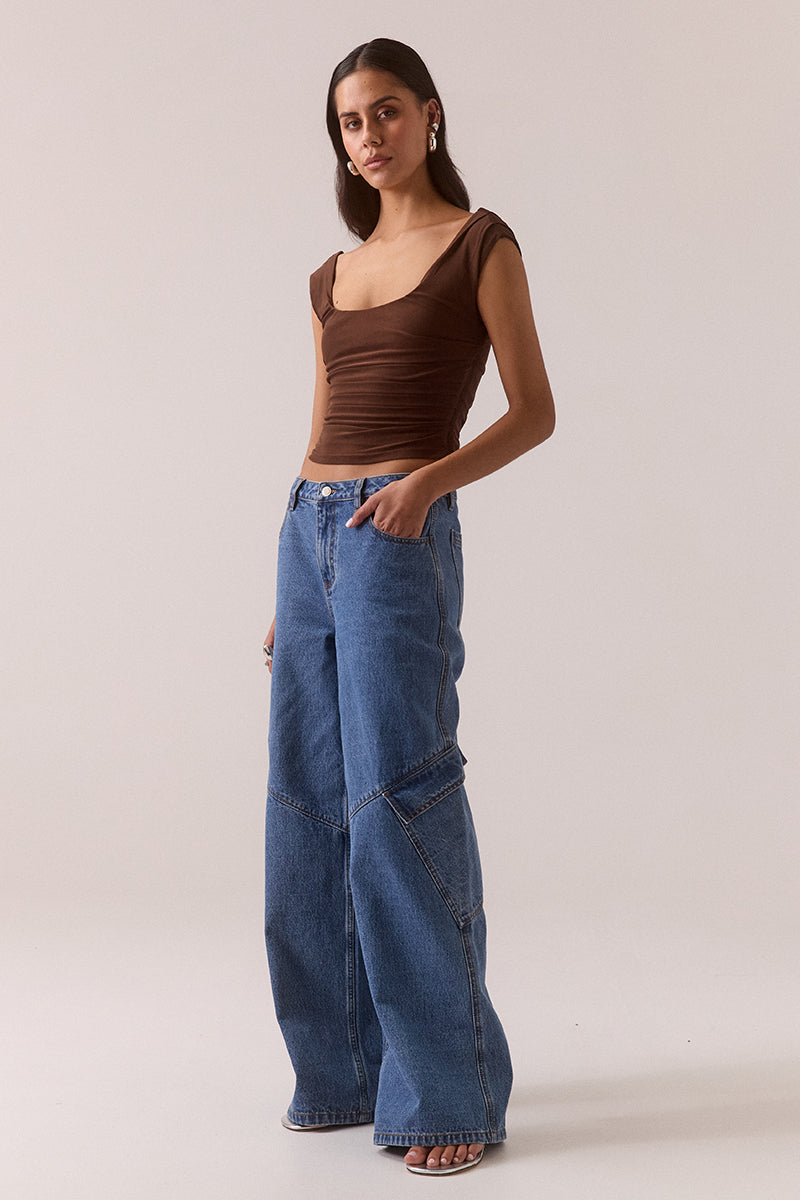 Sleeveless stretch mesh top with wide scoop neckline and fitted silhouette