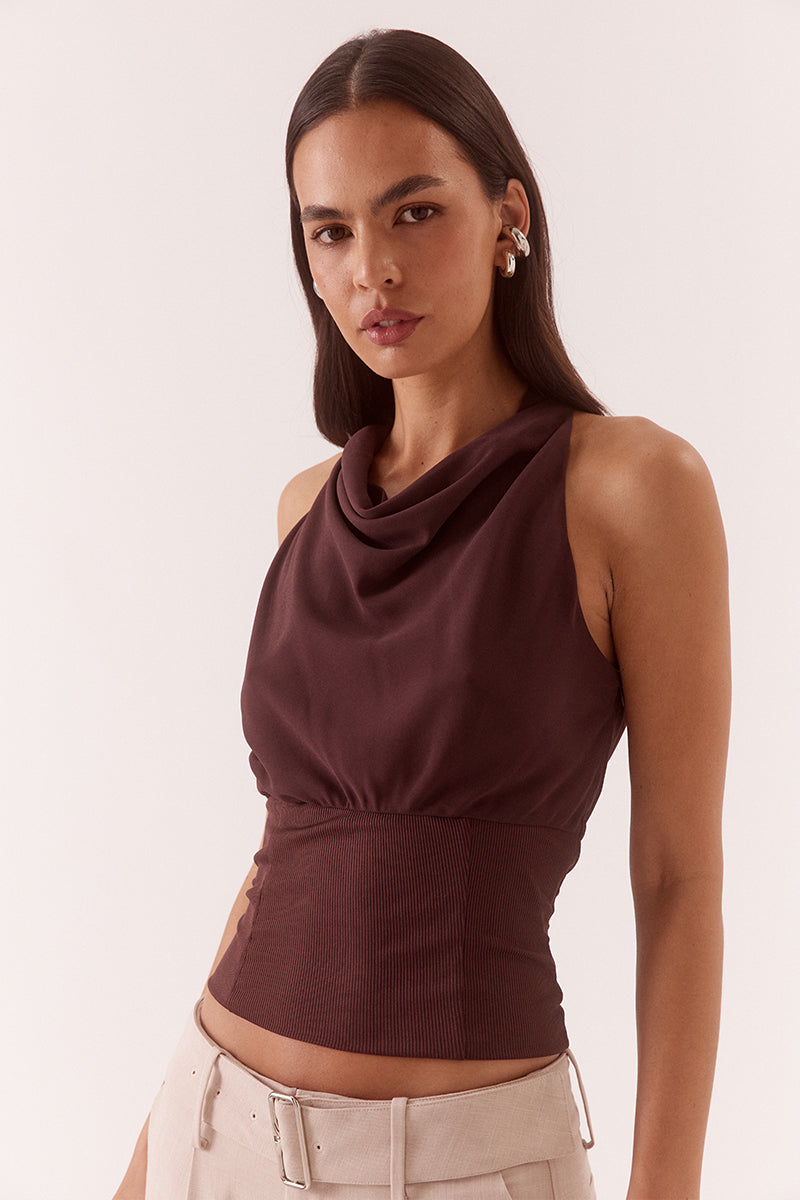 Women’s high cowl neck top with chiffon upper, textured stretch waistband, soft gathers at bust, back keyhole detail, and side zip closure.