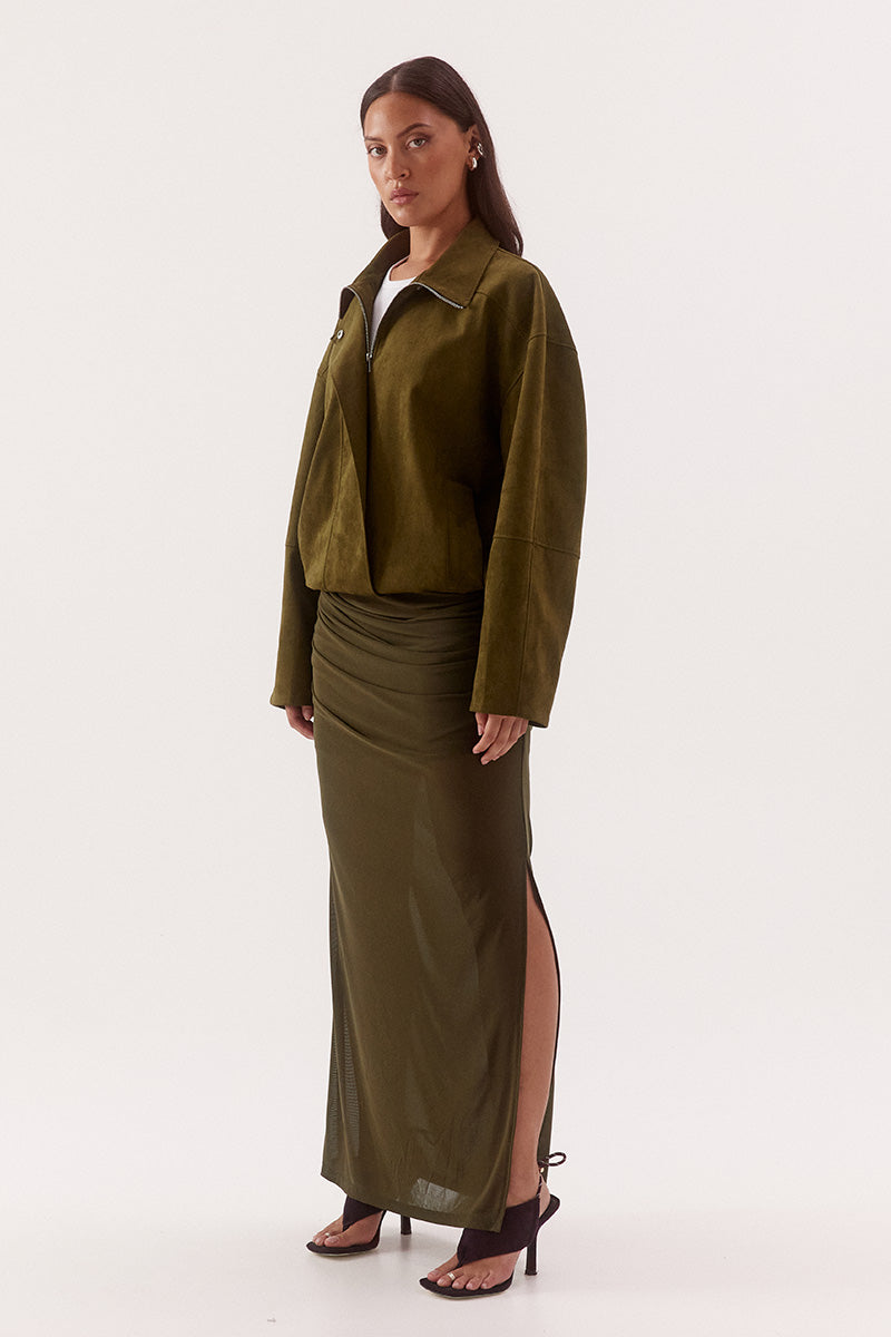 Women’s faux suede bomber jacket with dropped shoulders, front zip closure, welt pockets, chest zip detail, and elasticated hem finish.