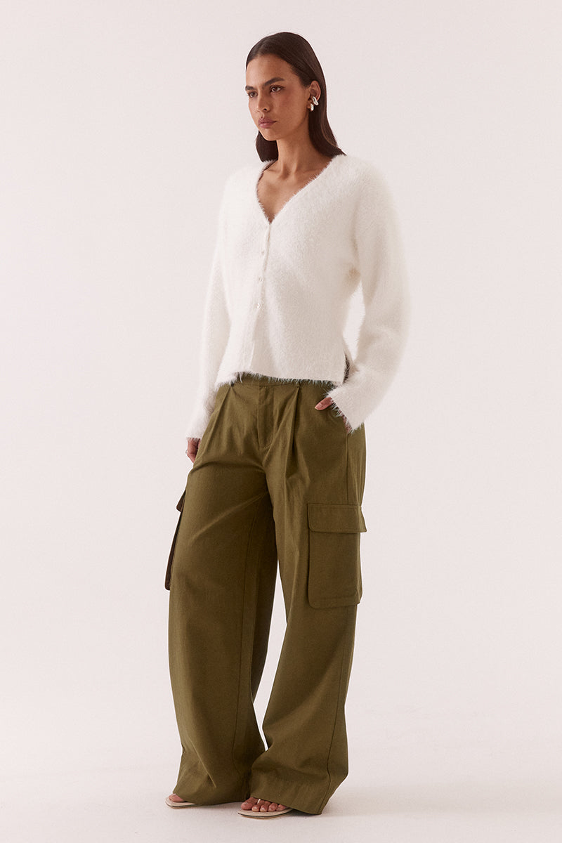 Women’s fluffy nylon knit cardigan with relaxed fit, low V-neck, dropped shoulders, fitted waist, button closure and side splits