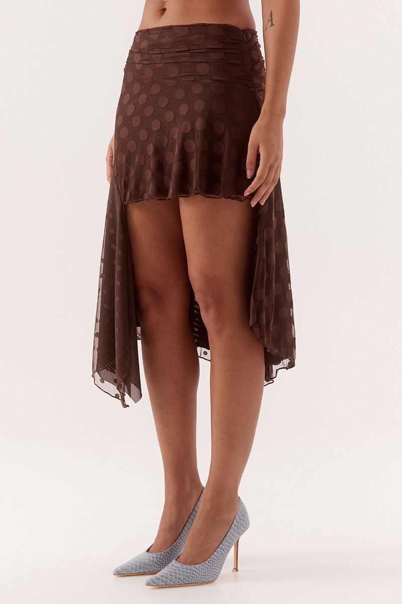 Mid-rise skirt in dot stretch mesh with circle cut side panels and asymmetric hem