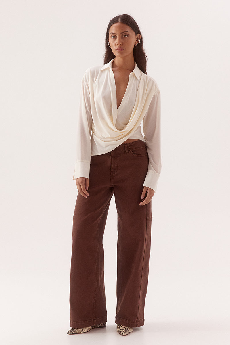 Women's stretch mesh drape front shirt with cowl wrap neckline, dropped shoulders, two-piece collar and wide split cuffs.