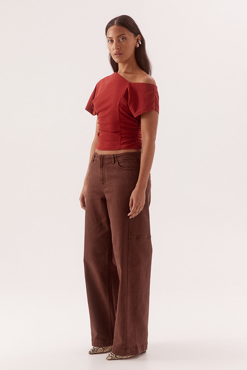 Textured mesh off shoulder top with asymmetric neckline, gathered waist, short sleeves and versatile shoulder styling