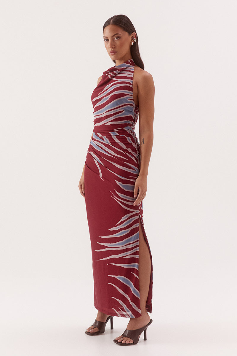 Women's fitted stretch mesh midi dress in exclusive print with a halter cowl neckline, gathered bodice, layered skirt, and side split detail.