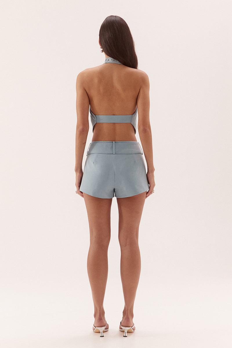 Apron style top in stretch woven rayon with high cowl neckline and V-front hem