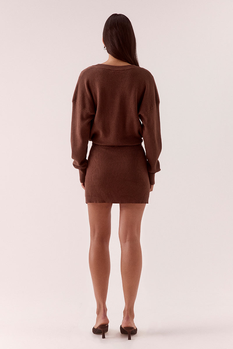 Women’s knit mini dress with deep V-neck, dropped shoulders, long sleeves, ribbed waist with belt loops and attached leather belt detail