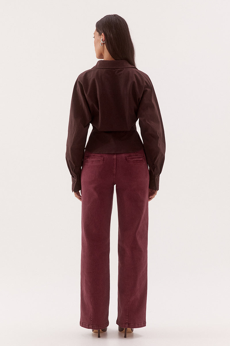 Women's cotton blend long sleeve shirt with a cinched waist, barrel sleeves, concealed button front, two-piece collar, and shaping seam details.