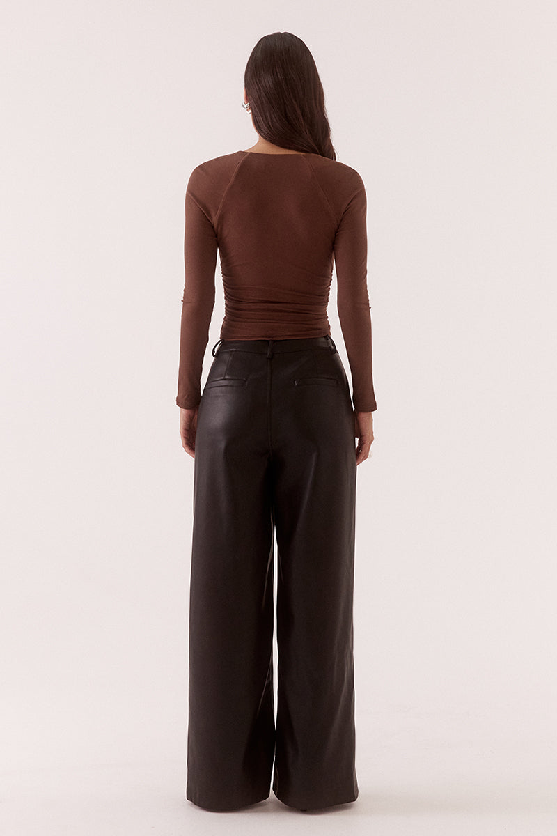 Women’s fitted long sleeve top in rayon blend with front bust cut-out, built-in wire support, gathered bust and waist, and elastic armholes