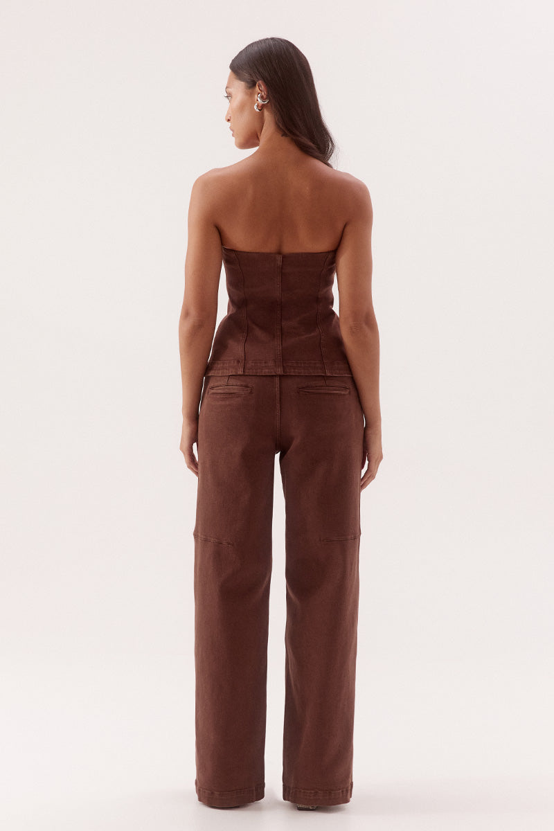 Women's cotton blend denim strapless fitted top with front hook and eye fastening, panel detailing and shaping darts.