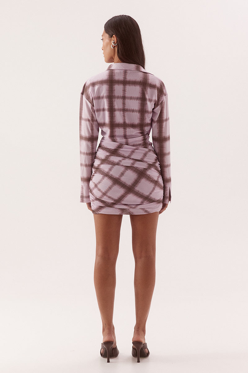 Women's exclusive print textured stretch mesh mini dress with drape front, cowl wrap neckline, dropped shoulders and gathered skirt overlay.