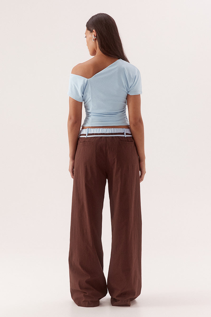 Textured mesh off shoulder top with asymmetric neckline, gathered waist, short sleeves and versatile shoulder styling