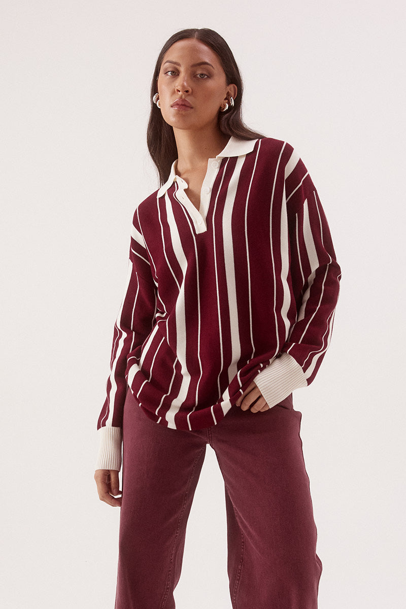 Women’s oversized knit sweater with multicolour stripe design, collar with button placket, dropped shoulders and ribbed cuffs, hem and trims