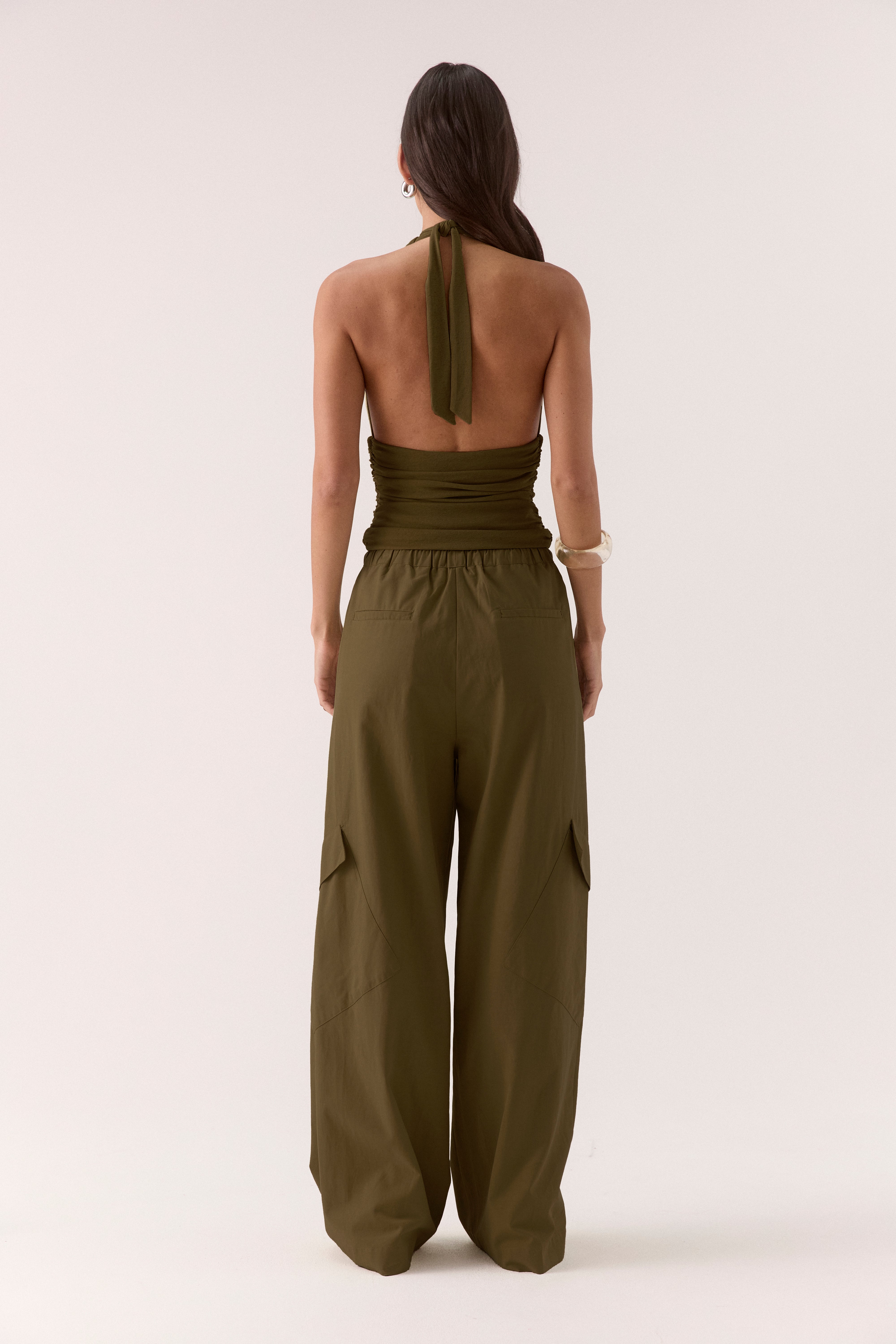 Women’s textured stretch mesh empire halter neck top with gathered side detailing, back neck tie, elasticated back and flattering fitted silhouette.