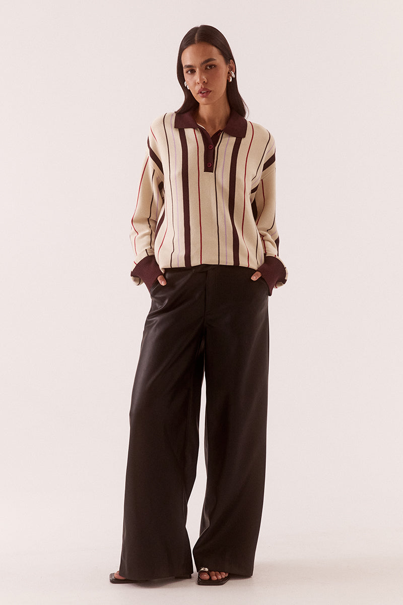 Women’s oversized knit sweater with multicolour stripe design, collar with button placket, dropped shoulders and ribbed cuffs, hem and trims