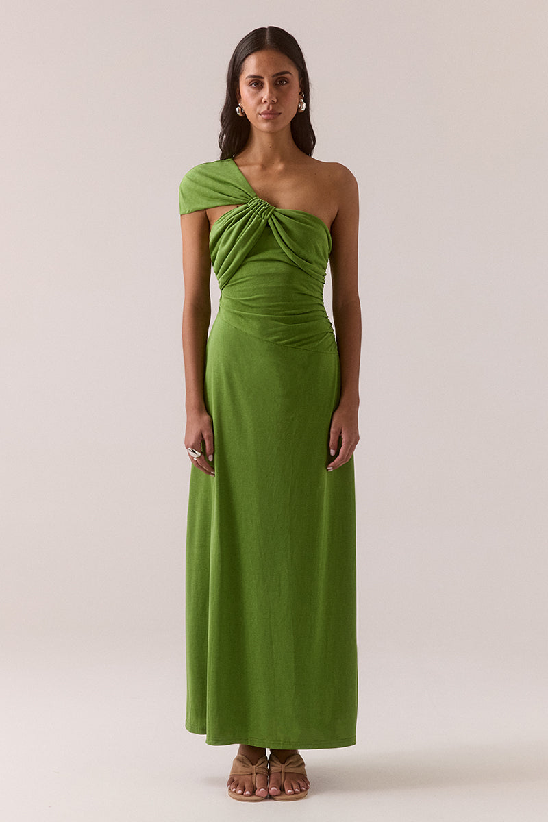 Asymmetric neckline stretch modal blend maxi dress with fitted dropped waist, gathered waist and shoulder details, internal bralette and invisible side zipper, worn by model in size 8.