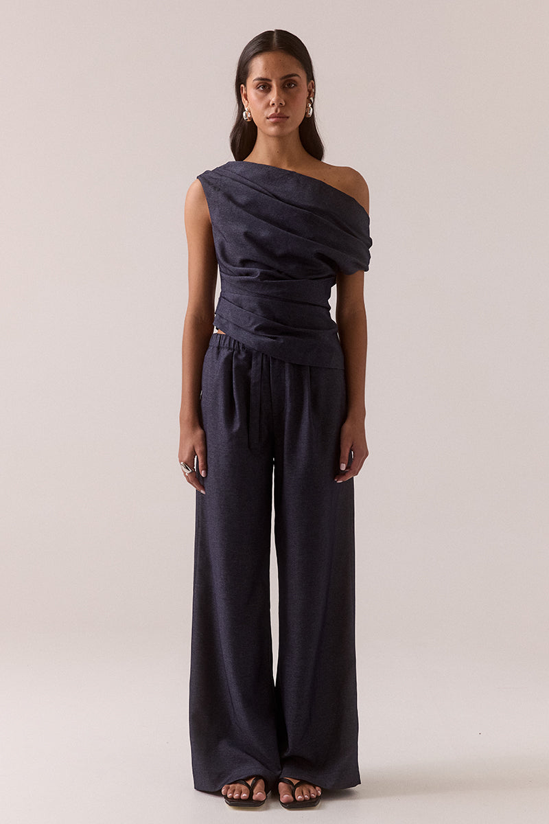 Mid-rise tailored pants with soft straight leg and front tuck detailing