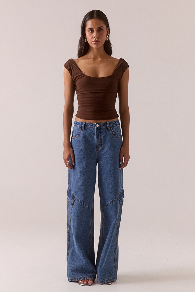 Sleeveless stretch mesh top with wide scoop neckline and fitted silhouette