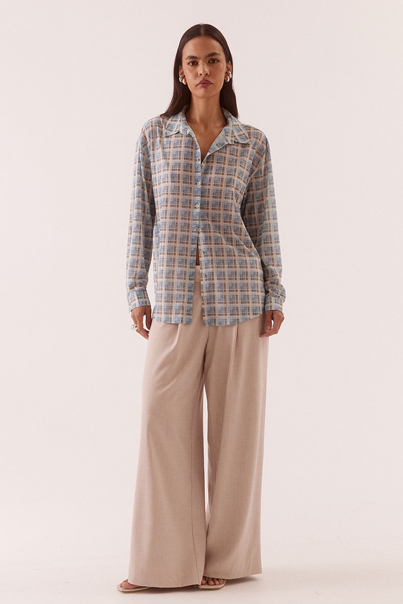 Women’s oversized long sleeve printed stretch mesh shirt with dropped shoulders, button front closure, shaped hem, and two-piece collar detail.