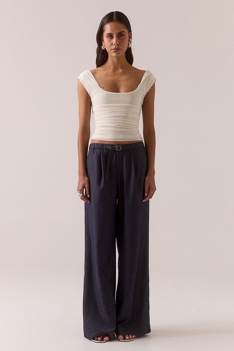 Sleeveless stretch mesh top with wide scoop neckline and fitted silhouette