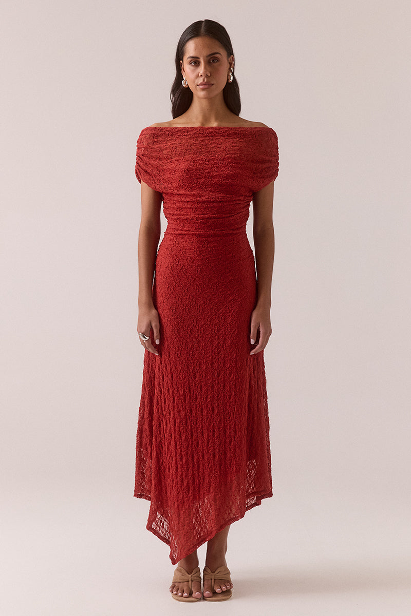 Off shoulder stretch lace midi dress with asymmetric hem, gathered waist and shoulders, internal bralette lining and left side split, worn by model in size 8.