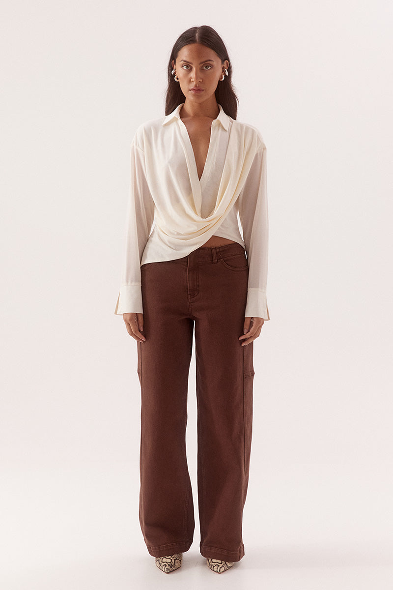 Women's stretch mesh drape front shirt with cowl wrap neckline, dropped shoulders, two-piece collar and wide split cuffs.