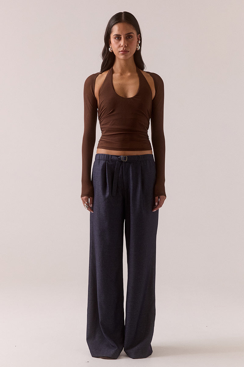 Model wearing stretch mesh two-piece maxi dress with halter neck top, long sleeve bolero, scoop neckline, built-in bralette support, side ruching, and fully lined non-sheer body-contouring fit.