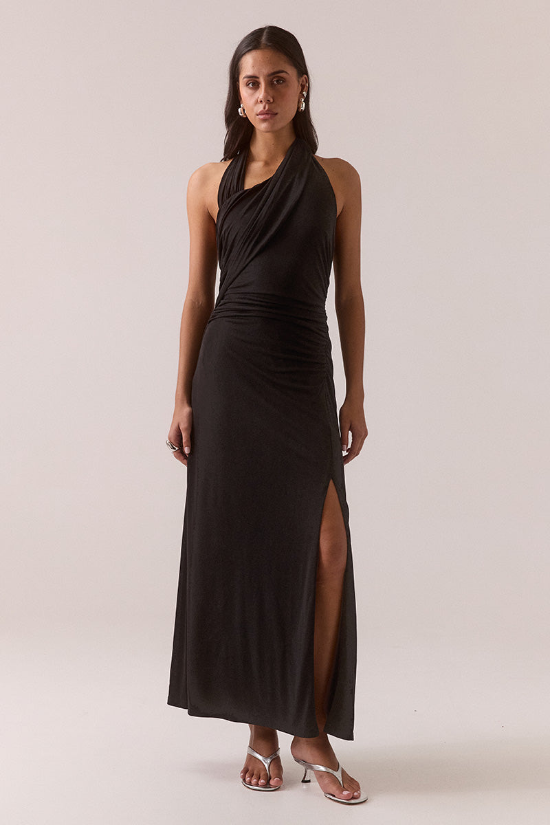 Women’s halter neck dress in stretchy modal blend with gathered waist, front neckline overlay, back neck ties, and front leg split.