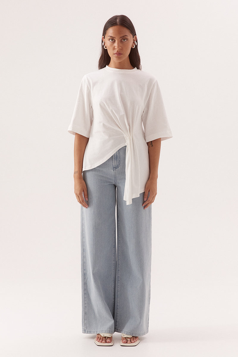 Relaxed fit T-shirt mini dress in cotton with cinched waist and asymmetric pleated hem