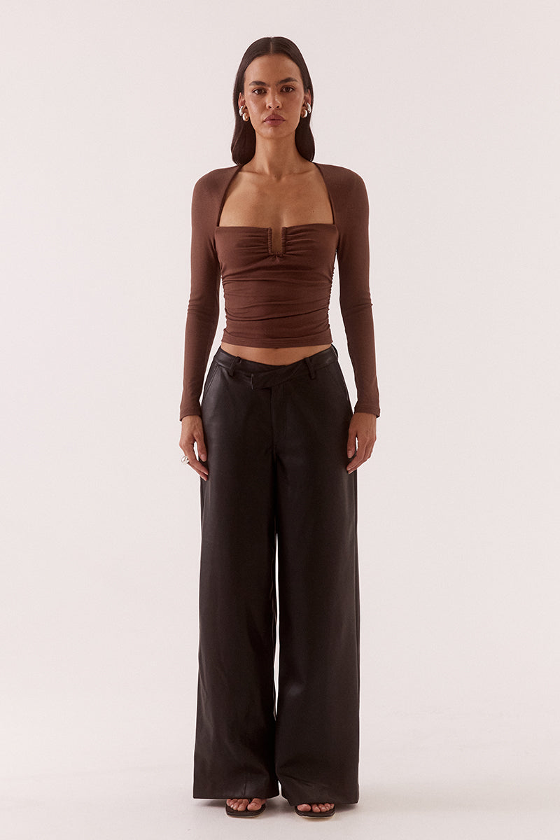Women’s fitted long sleeve top in rayon blend with front bust cut-out, built-in wire support, gathered bust and waist, and elastic armholes