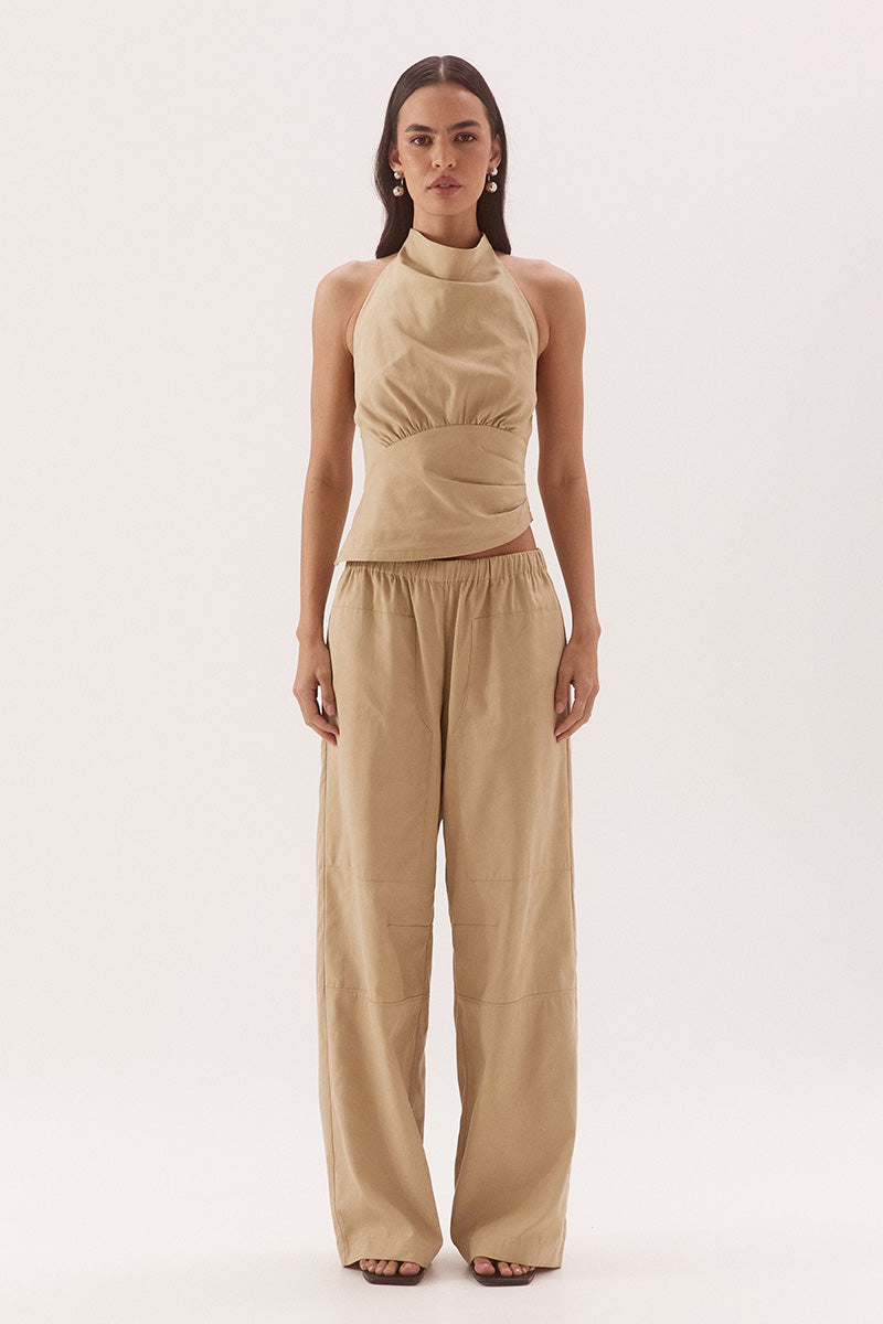 Women's cotton Lyocell blend mid-rise relaxed straight leg pants with oversized side patch pockets, elastic waist and dart detailing.