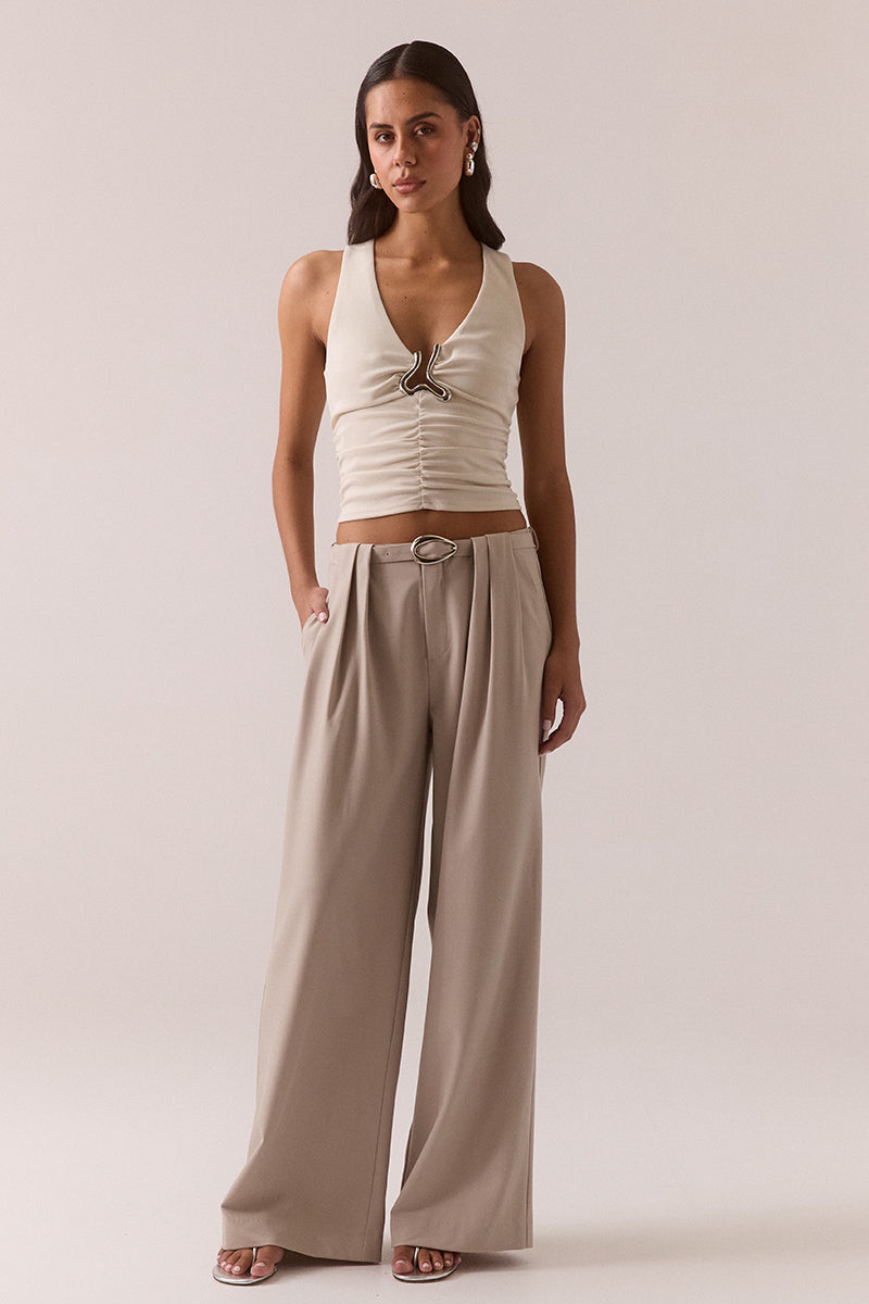 Mid rise wide-leg stretch rayon blend pants with front pleats, removable belt with silver buckle, angled front pockets and back welt pockets.