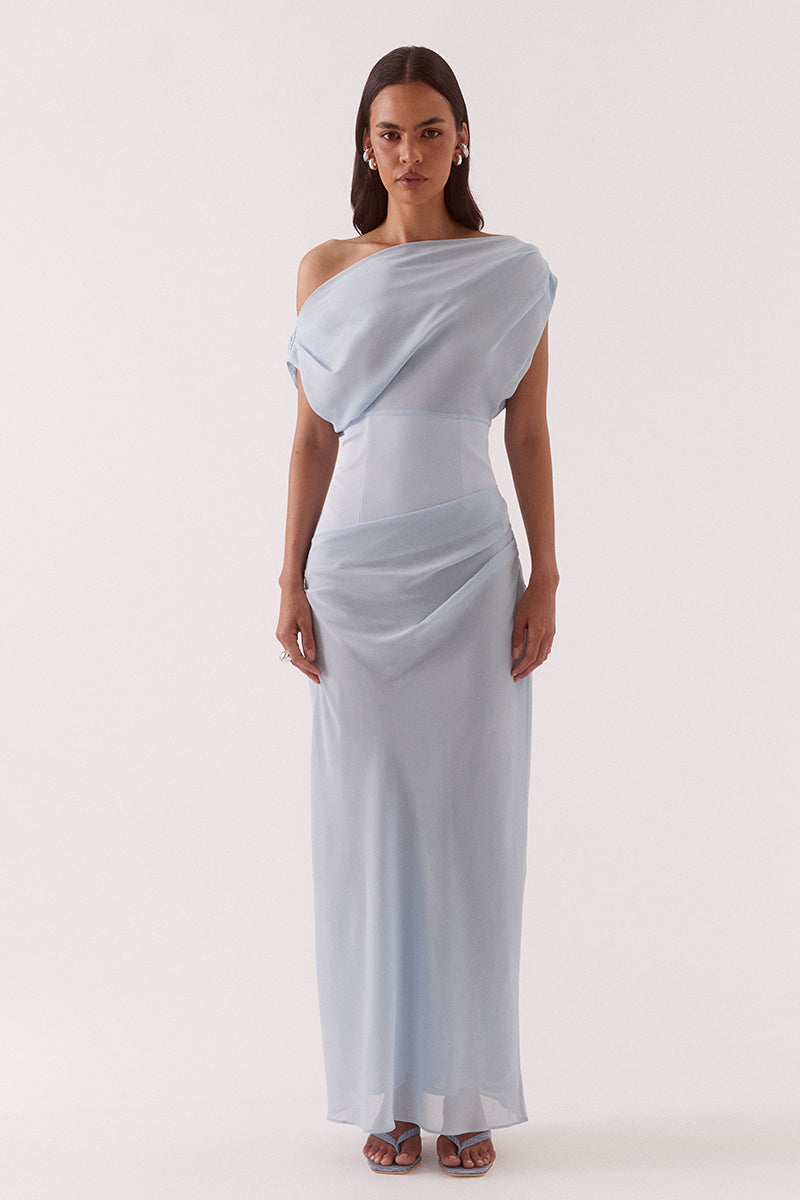 Women’s A-line maxi dress with chiffon upper, textured stretch waistband, draped overlayer skirt, boat neck neckline, long sleeves, and side zip closure.