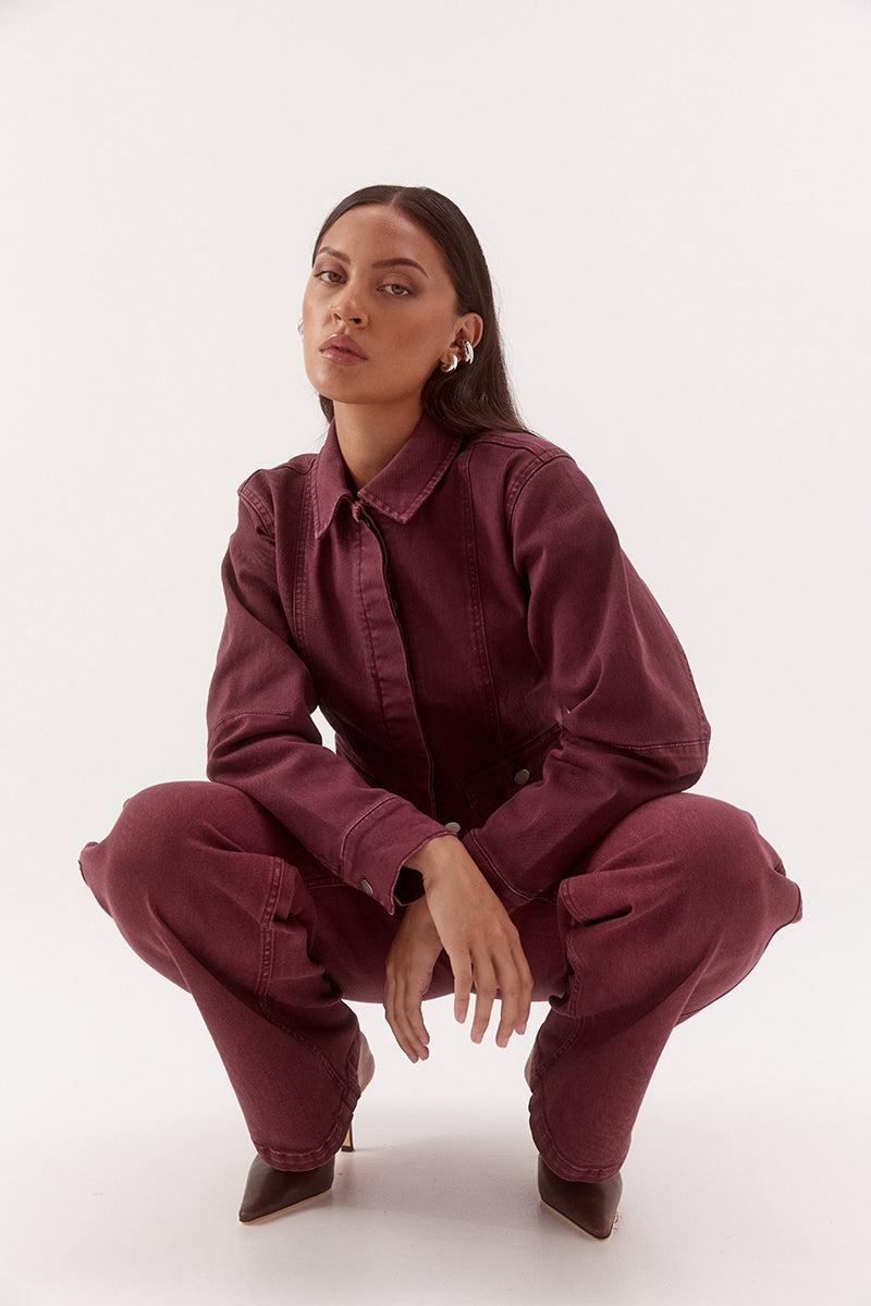 Women's fitted cotton blend denim jacket with a two-piece collar, concealed front button placket, princess seams, and flap pockets.