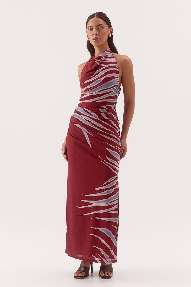 Women's fitted stretch mesh midi dress in exclusive print with a halter cowl neckline, gathered bodice, layered skirt, and side split detail.