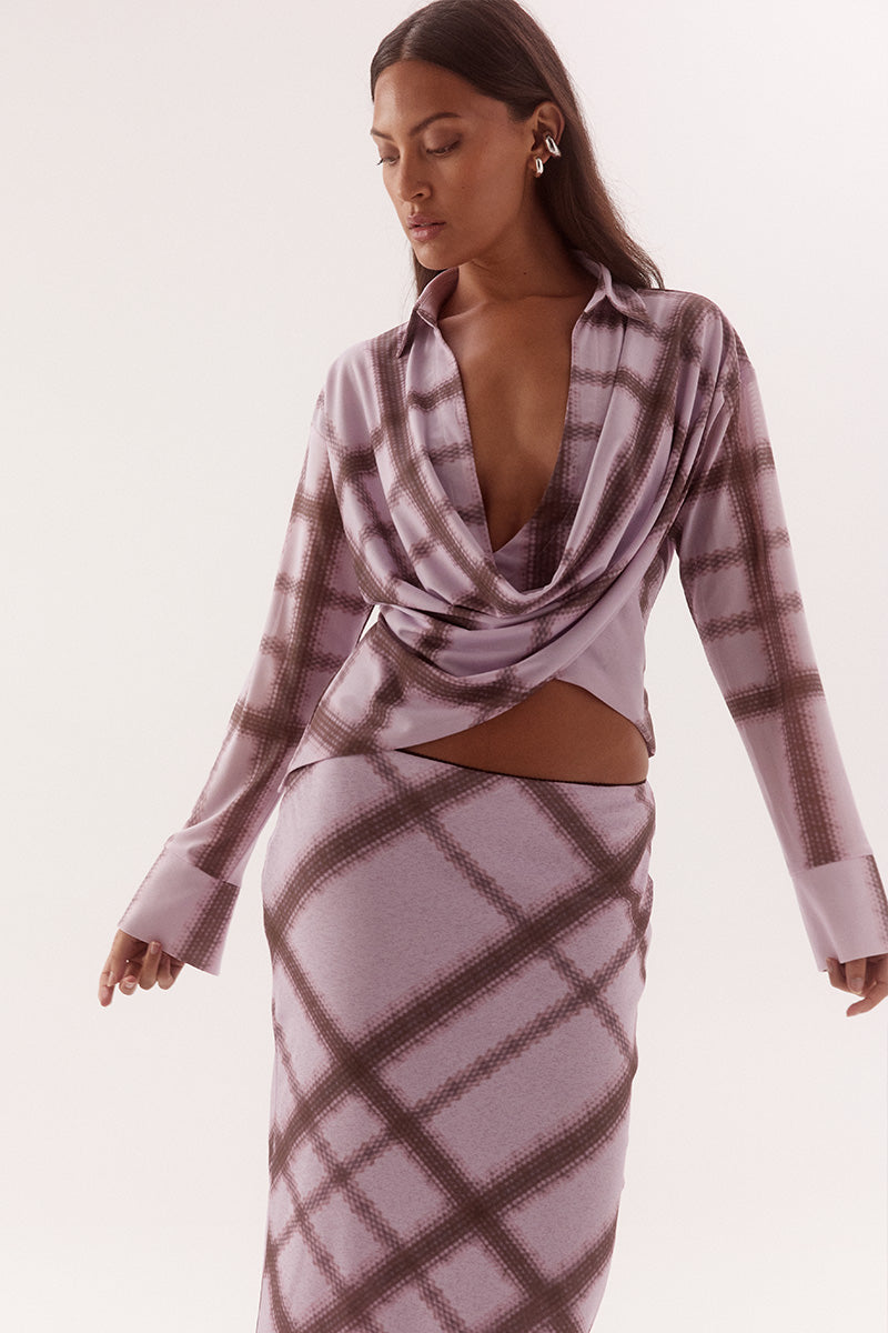 Women's textured stretch mesh drape front shirt with exclusive print, cowl wrap neckline, dropped shoulders and wide split cuffs.