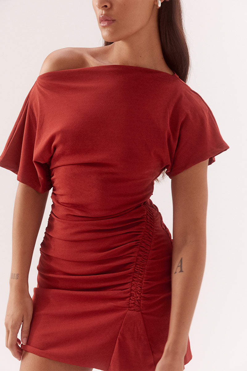Textured mesh mini dress with off shoulder or on shoulder styling, gathered waist, boat neckline and fitted silhouette