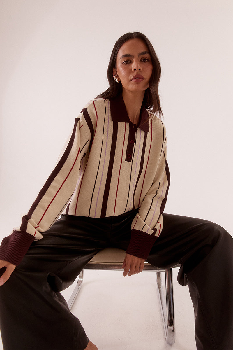 Women’s oversized knit sweater with multicolour stripe design, collar with button placket, dropped shoulders and ribbed cuffs, hem and trims