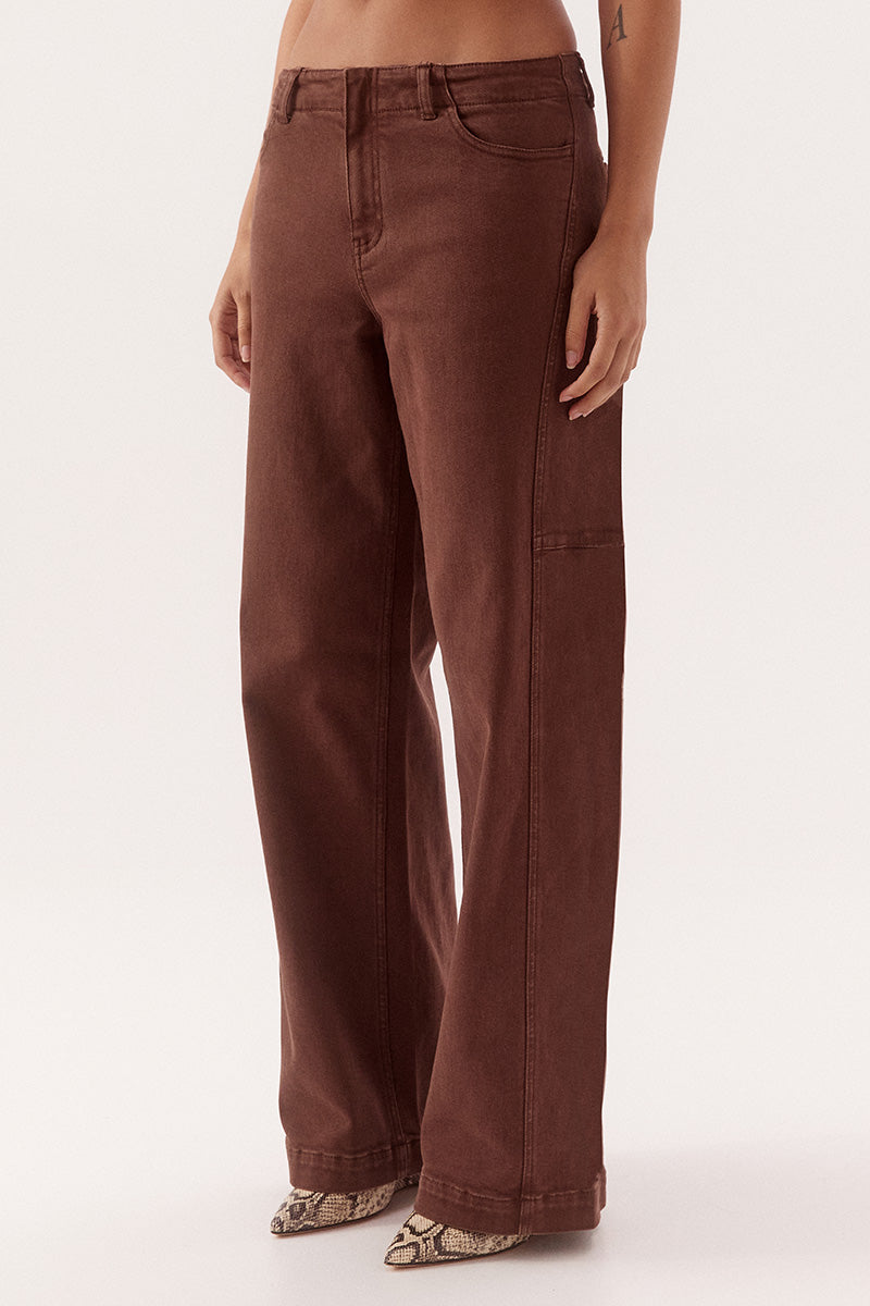 Women's cotton blend mid-rise straight leg jeans with front curved pockets, back welt pockets, fly front and knee dart detailing.