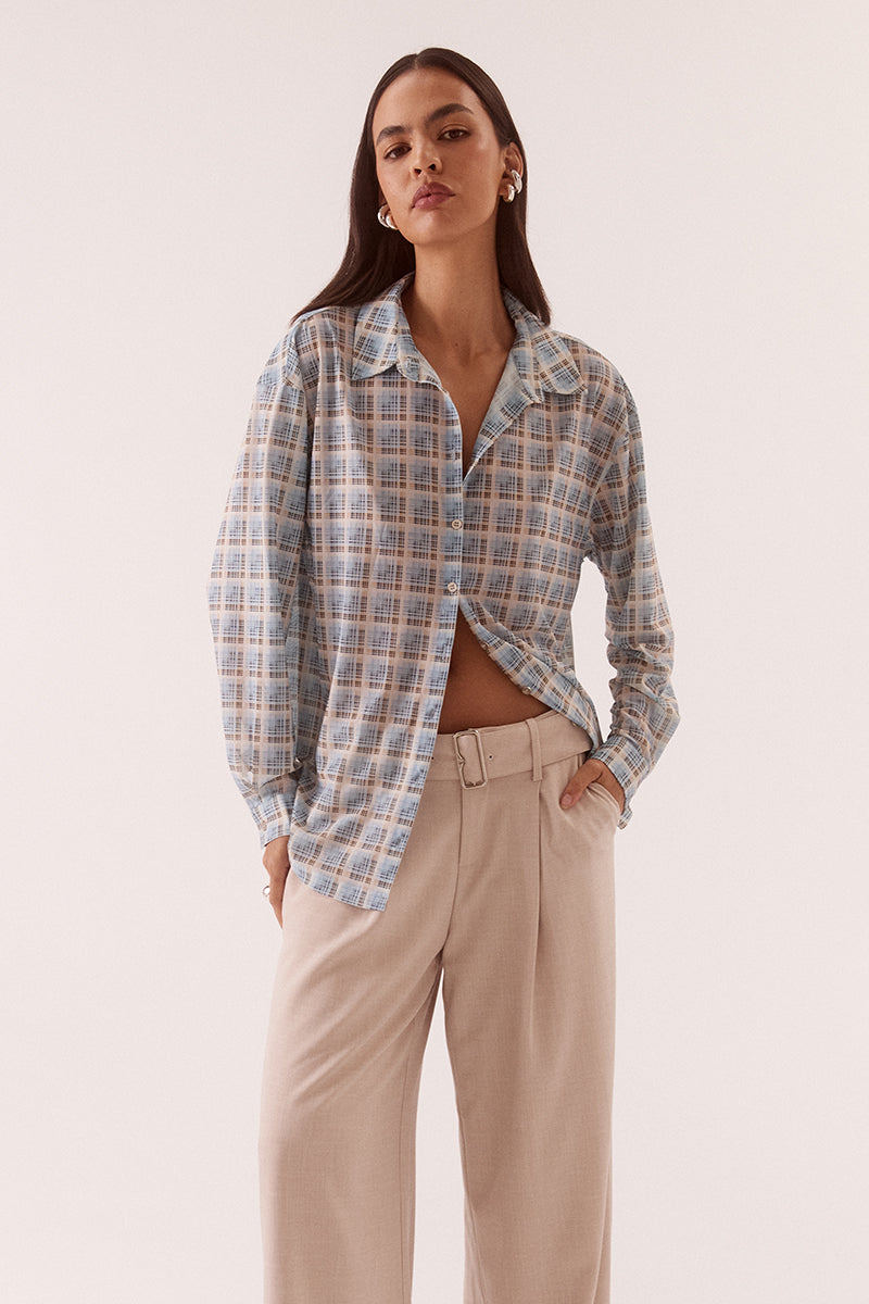 Women’s oversized long sleeve printed stretch mesh shirt with dropped shoulders, button front closure, shaped hem, and two-piece collar detail.