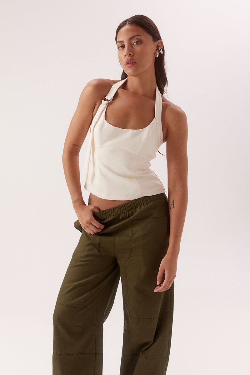 Black halter top with scooped neckline, adjustable strap, silver D ring detail, sculpted fit and fully lined viscose blend fabrication