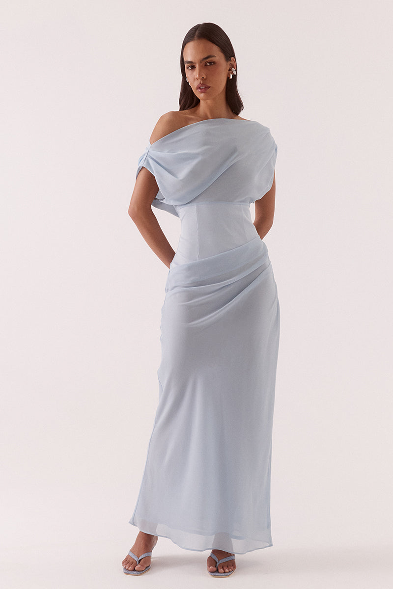 Women’s A-line maxi dress with chiffon upper, textured stretch waistband, draped overlayer skirt, boat neck neckline, long sleeves, and side zip closure.